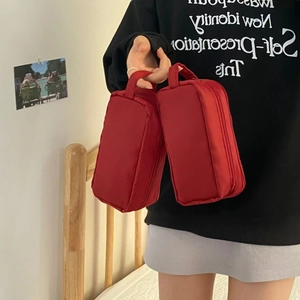 Dual red nylon organizer bags with sturdy top handles for cosmetics and storage