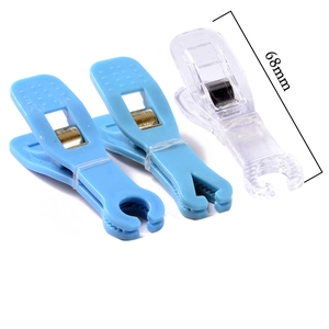 Detail of 68mm acrylic piercing forceps showing length measurement and clear plastic texture