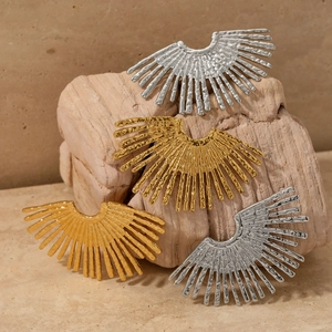 Chunky hammered sunflower statement earrings in gold and silver finish on stone