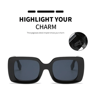 Detail view of sturdy metal hinges on black square oversized sunglasses frames