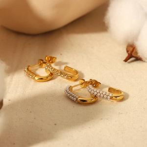 Elegant C-shaped 18k gold-plated titanium earrings with white pearls and small diamonds