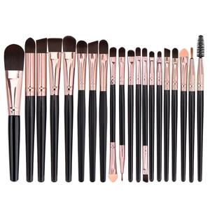 20-piece makeup brush set with black handles and rose gold ferrules on white background