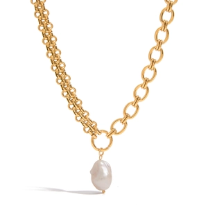 Asymmetric gold necklace with baroque pearl pendant and mixed chain link textures