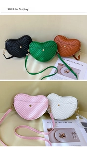 Still life showcase of heart-shaped quilted crossbody bags in five stylish colors