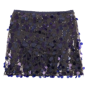 Detailed view of shimmering purple and blue sequins on a mini skirt with fringe details
