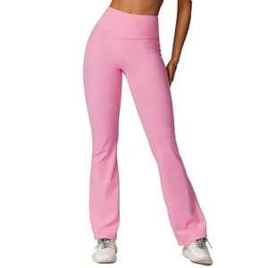 Pink high-waisted yoga flare pants in stretchy fabric, slimming athletic bell bottom design