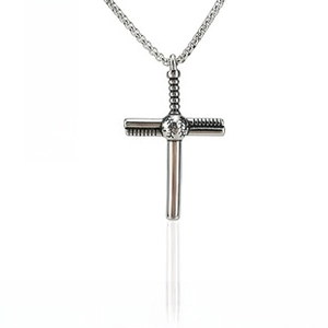 Macro detail of silver baseball cross pendant with bats on a sleek metal chain