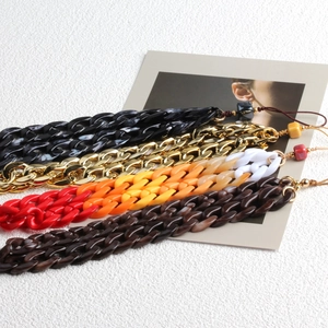 Bohemian style colorful acrylic and metal phone lanyards in four different marble patterns