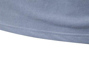 Detail of double-stitched hem and breathable piqué mesh fabric on khaki polo shirt