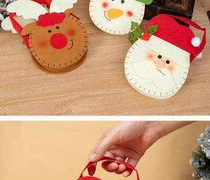 Detail of Christmas felt gift bags featuring Santa, reindeer and snowman character designs