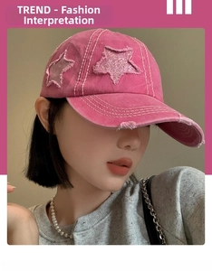 Detail of pink vintage baseball cap featuring distressed star embroidery and stitching