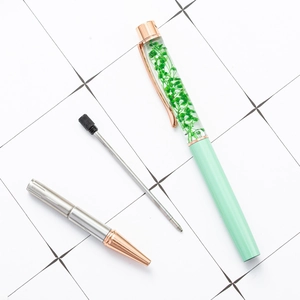 DIY herbarium ballpoint pen with dried flowers in mint green and rose gold finish