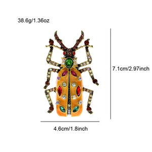 Vintage enamel beetle brooch with colorful rhinestones measuring 7.1cm by 4.6cm