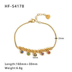 Detail view of gold bead bracelet with colorful stone charms and sizing measurements