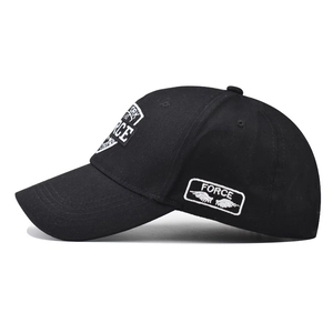 Black cotton baseball cap with white FORCE letter embroidery and wing detail in side view