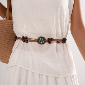 Bohemian braided waist chain with wood beads and turquoise flower buckle on white dress