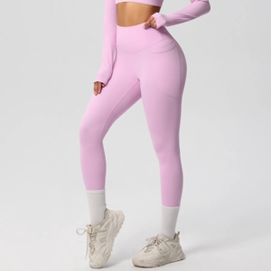 Detail of high waist yoga pants with side pocket for phone in pink moisture-wicking fabric