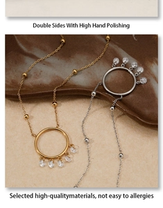 Close-up of a circular dreamcatcher necklace with zircon pendants and polished finish