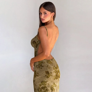 Close-up of olive green tie-dye velvet dress with gold metal chain straps and backless detail