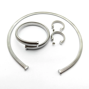 Three-piece silver Tubogas jewelry set featuring flexible choker, cuff bracelet, and C-earrings