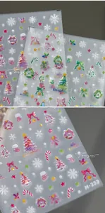 Detail of laser holographic Christmas nail stickers featuring snowflakes and trees M-253