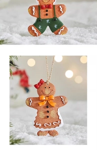 Close-up of resin gingerbread man ornaments with detailed textures and rustic twine ropes
