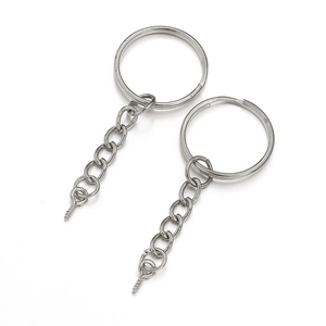 Detail of silver metal keychains with chain link and eye screw connector for DIY crafts
