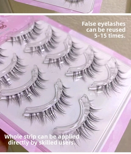 Detail view of 5 pairs of natural long false eyelashes set in a pink tray packaging