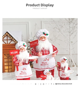 Detail view of chef Santa dolls in red checkered shirts with Welcome signs and display trays