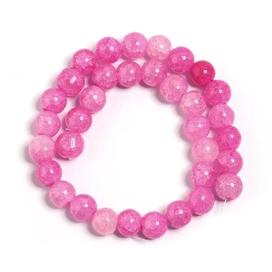 Detailed view of vibrant rose pink cracked glass beads for DIY jewelry making and crafts