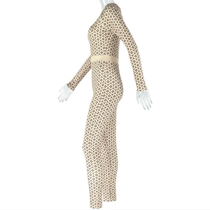 Detail view of brown geometric print long sleeve jumpsuit with waist slimming design