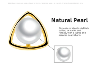 Detailed macro view of the natural freshwater pearl set in a golden triangular frame