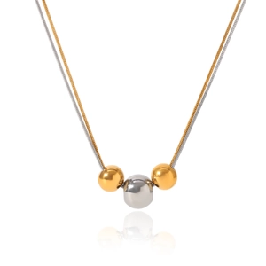 Detail of two-tone stainless steel snake chain necklace with gold and silver beads