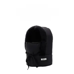 Close-up of black winter trapper hat featuring thick faux fur lining and windproof fabric