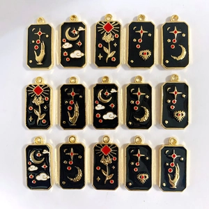 Black and gold celestial tarot pendants with moon and eye motifs for DIY jewelry making