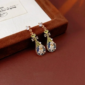 Vintage gold pipa earrings with colorful enamel floral details and sparkling zircons