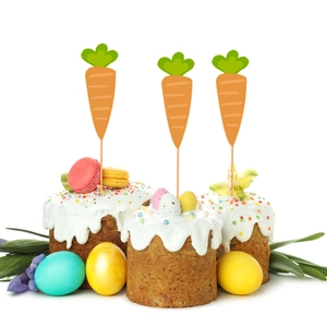 Set of three carrot-shaped Easter cake toppers on frosted cupcakes with white background