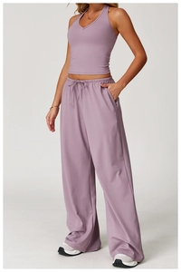 Detail view of lilac yoga set with V-neck halter top and drawstring wide-leg pants