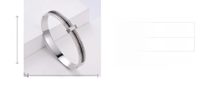 Detailed dimension view of polished silver steel bangle with black and white stones