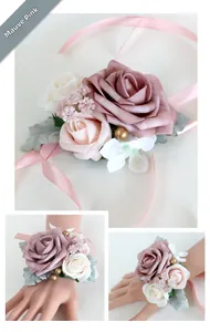 Close-up of dusty pink faux rose corsage with silk ribbons for wedding bridesmaids