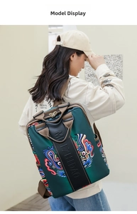 Detailed side view of green backpack with dragon print on model in outdoor setting