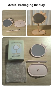 Pink desktop vanity mirror with cute bow, storage base and full packaging contents
