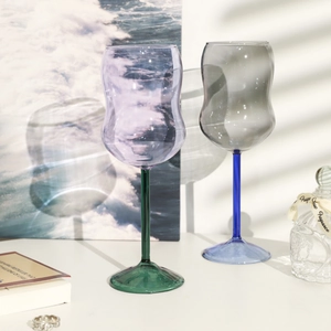 Colorful high-borosilicate glass goblets with wavy texture in purple and grey shades