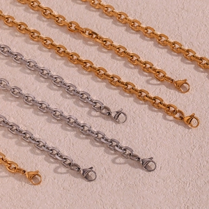 Detailed macro view of 18K gold and silver plated stainless steel O-chains with lobster clasps