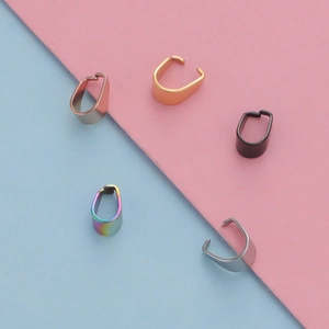 Macro shot of 3x7mm stainless steel bail clasps in gold silver black and rose gold finishes