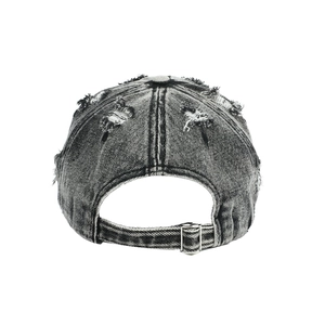 Detail of vintage washed charcoal baseball cap with distressed holes and adjustable metal buckle