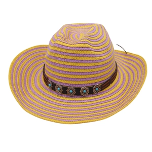 Detail of striped woven straw cowboy hat featuring brown leather band and ethnic stone studs