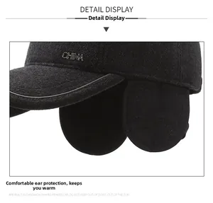 Detail view of winter wool cap with fold-down earflaps and metal CHINA lettering