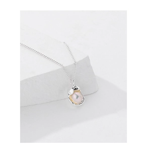 Detailed close-up of a premium shell pearl necklace with irregular s925 silver setting