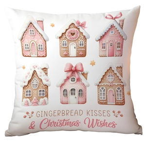 Detail of gingerbread house pattern and Christmas wishes text on a white festive pillowcase